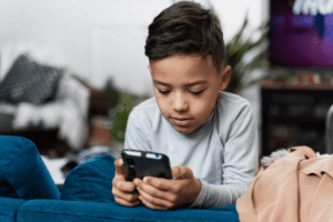 child using mobile phone – prevent mobile addiction in kids